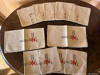 All twelve napkins arranged to show both motif types