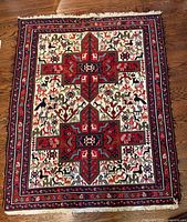 Full view of Kazak rug showing design and colors