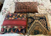 Front views of all three pillows on bed