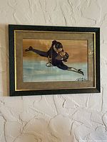 Full view of framed watercolor painting on wall