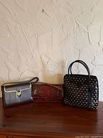 All three bags side by side on surface