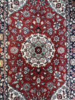 close-up of rug center showing medallion and floral pattern