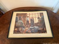 Full view of framed print on table