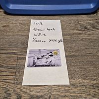 Full view of coin on Steamboat Willie card