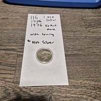 Full view of coin within capsule on noted sheet