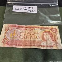 Full front view of 1974 $2 banknote with reference bag