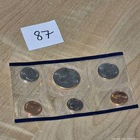 Front view of sealed 1988 uncirculated coin set showing all six coins in clear sleeve