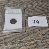 Full view of encapsulated coin on tabletop