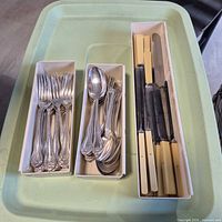 Boxed forks, spoons and cream-handled knives