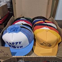 Open box showing stacked caps—colour variety visible