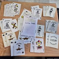 Overview of envelope marked 40 jokers surrounded by assorted cards