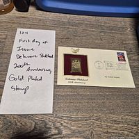 Entire first day cover with handwritten note beside