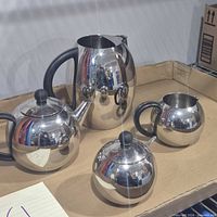 Full set showing all four stainless pieces