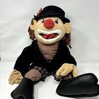 Front view of Folkmanis hobo clown puppet seated, showing entire figure and clothing details