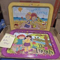 Both trays in box showing designs and note