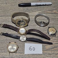 Group shot of all six wristwatches for count and overview