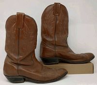 Left and right side view of both boots showing shaft stitching, leather condition and heels