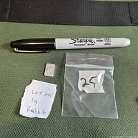 Full view showing silver bar, scale objects present