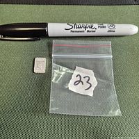 Bar beside marker for scale and zip bag