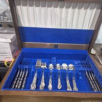 Open chest showing full set of flatware pieces