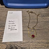 Full view of necklace with handwritten lot note