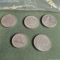 Five Canadian coins reverse sides showing commemorative designs