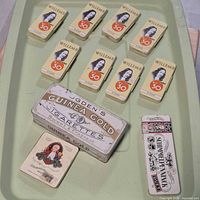 Overview of 12 tins on tray