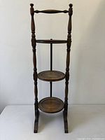 Full front view of three-tier solid walnut folding pie stand