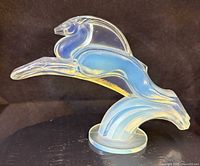 Left profile of opalescent gazelle sculpture showing full figure and base