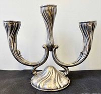 Front view of three-arm .835 silver candelabra