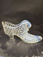 Left side view of opalescent hobnail glass shoe