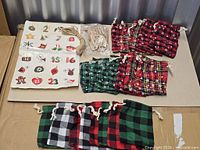 Assorted plaid drawstring bags, stickers sheet, clothespins, jute twine displayed