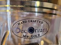 Close-up of Decorium label showing hand crafted 24k gold detail