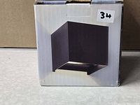 Front of box showing cube-style sconce