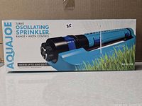 Front of boxed Aqua Joe turbo oscillating sprinkler