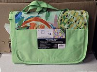 Folded Mainstays outdoor blanket in carrier showing pattern, handle and pocket
