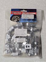 Front view of sealed package showing 20 lug nuts and label