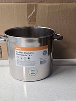 Front view of Anko 7.6 L stainless steel stock pot showing label and handles