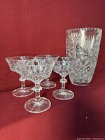 Vase with four cups showing overall lot