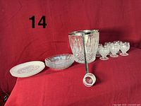 Full lot showing punch bowl, ladle, cups and two stacks of dessert plates