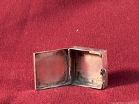 Open sterling stamp box interior view