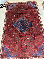 Full view of Persian rug showing pattern and removed main border