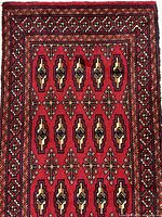 Front face of rug showing full pattern and border