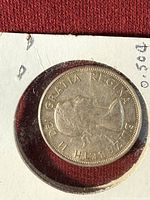 Obverse showing Queen Elizabeth II portrait, coin in cardboard holder