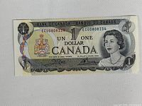 Obverse of 1973 $1 note showing Queen Elizabeth II, serial ECU0808234