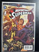 Front cover of Adventures of Superman #1 in protective sleeve