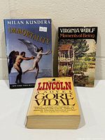 Front view showing all three paperback books: Immortality, Lincoln, Moments of Being