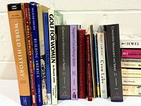 Front view of vertical row of textbooks and reference books