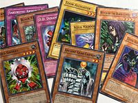 Overhead view showing ten 1st Edition Yu-Gi-Oh! cards spread out