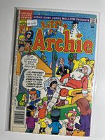Front cover of Little Archie issue 594 in sleeve